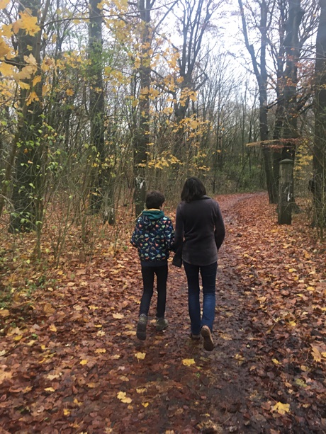 Adam and Alice walking in the forest