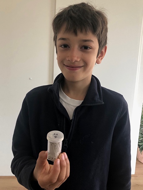Adam holding the vial with his female Acanthoscurria geniculata