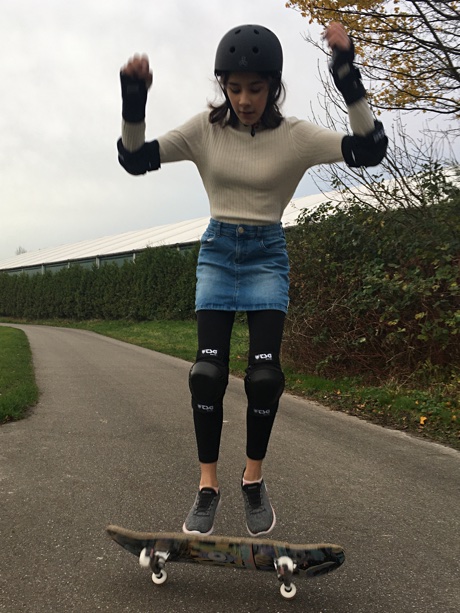 Alice trying to jump on her skateboard
