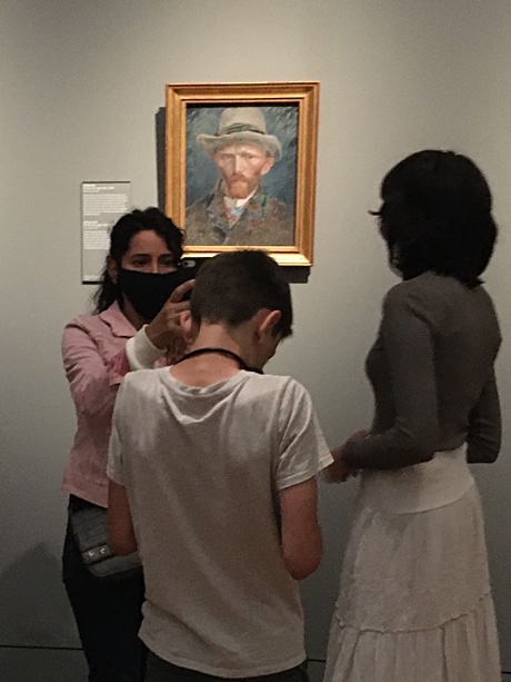 Esme, Adam, and Alice with Vincent van Gogh's self-portrait