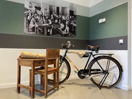 A school desk and a bicycle