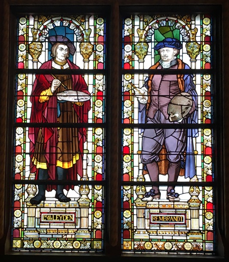 Stained glass windows showing Lucas van Leijden and Rembrandt