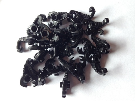Twenty black Lego scorpions
